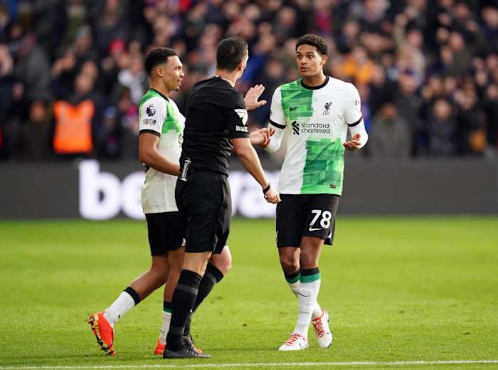 Liverpool defender Jarell Quansah pictured (right) complaining to referee Andrew Madley after conceding a penalty kick during a 2-1 win at Crystal Palace in December 2023